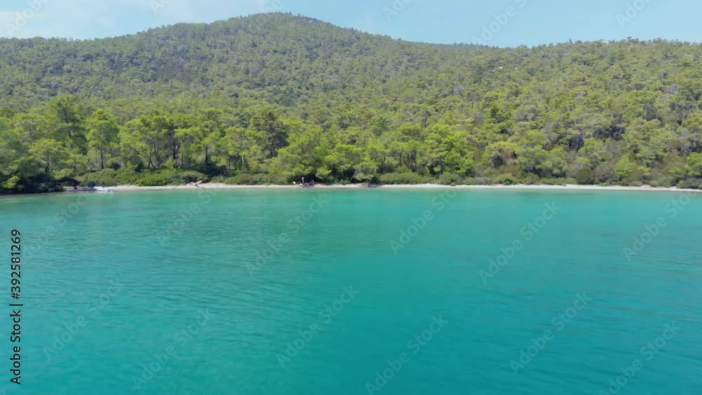 Aerial drone view over the coastline surrounded by green nature and Aegean sea waters in a secret bay in Akbuk, Didim, Turkey Aerial drone view over the coastline surrounded by green nature and Aegean sea waters in a secret bay in Akbuk, Didim, Turkey