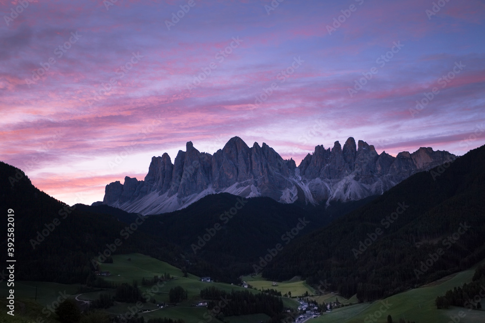 Sunrise over the small Italian mountain town of St. Magdalena in Val di Funes Sunrise over the small Italian mountain town of St. Magdalena in Val di Funes