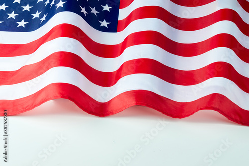 Close up of ruffled American flag. Satin texture curved flag of USA. Memorial Day or 4th of July. Banner, freedom concept