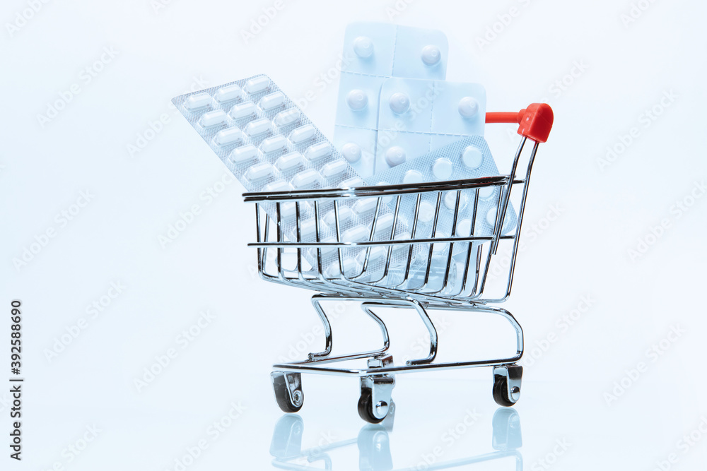 close up. packages with various tablets in the shopping cart.