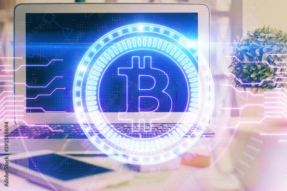 Multi exposure of blockchain and crypto economy theme hologram and table with computer background. Concept of bitcoin cryptocurrency. Multi exposure of blockchain and crypto economy theme hologram and table with computer background. Concept of bitcoin cryptocurrency.
