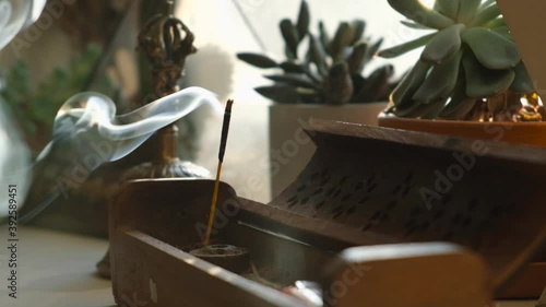 Incense stick smoke in slow motion close up