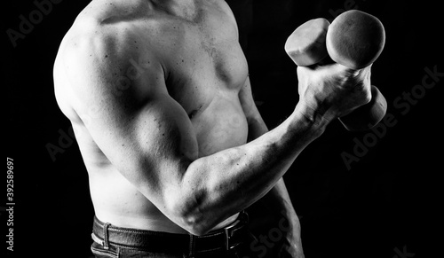 Obraz na płótnie Matured man with naked muscular torso making exercises