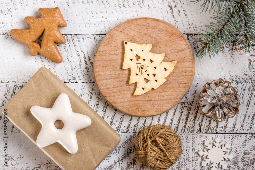 Merry christmas concepts with gift box, pastries and ornament element on white wooden table background