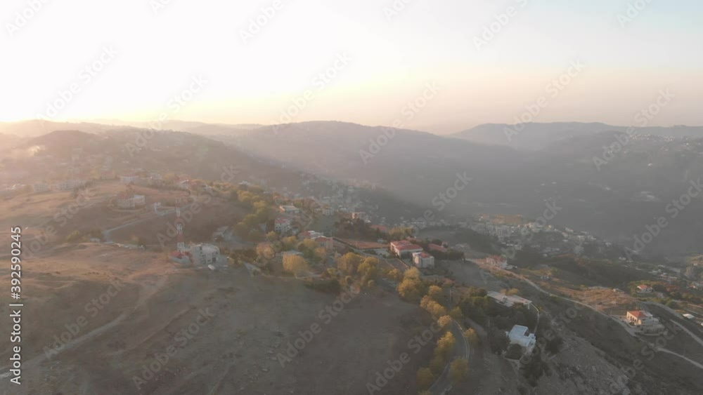 A mountain village with golden trees during Fall Autumn A mountain village with golden trees during Fall Autumn