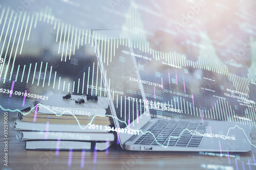 Stock market graph and table with computer background. Multi exposure. Concept of financial analysis. © peshkova