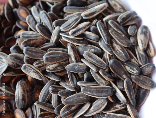 Fotografie Top view of background made of sunflower seeds.