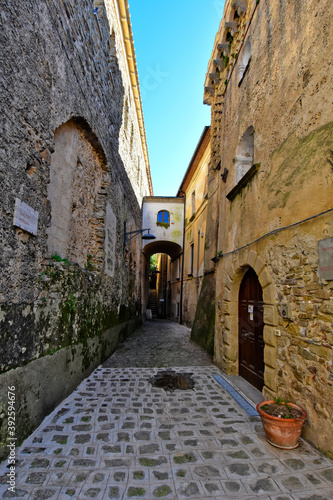 Fototapeta Naklejka Na Ścianę i Meble -  A narrow street among the old houses of Castellabate, a medieval village in the Campania region, Italy.
