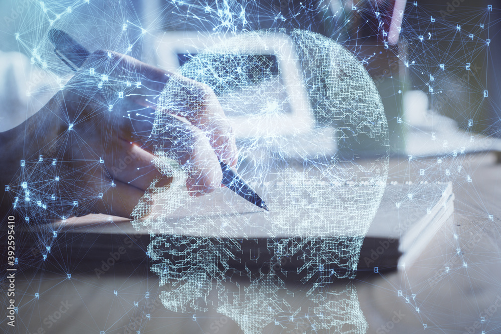 Obraz premium Multi exposure of writing hand on background with brain hologram. Concept of self learning.