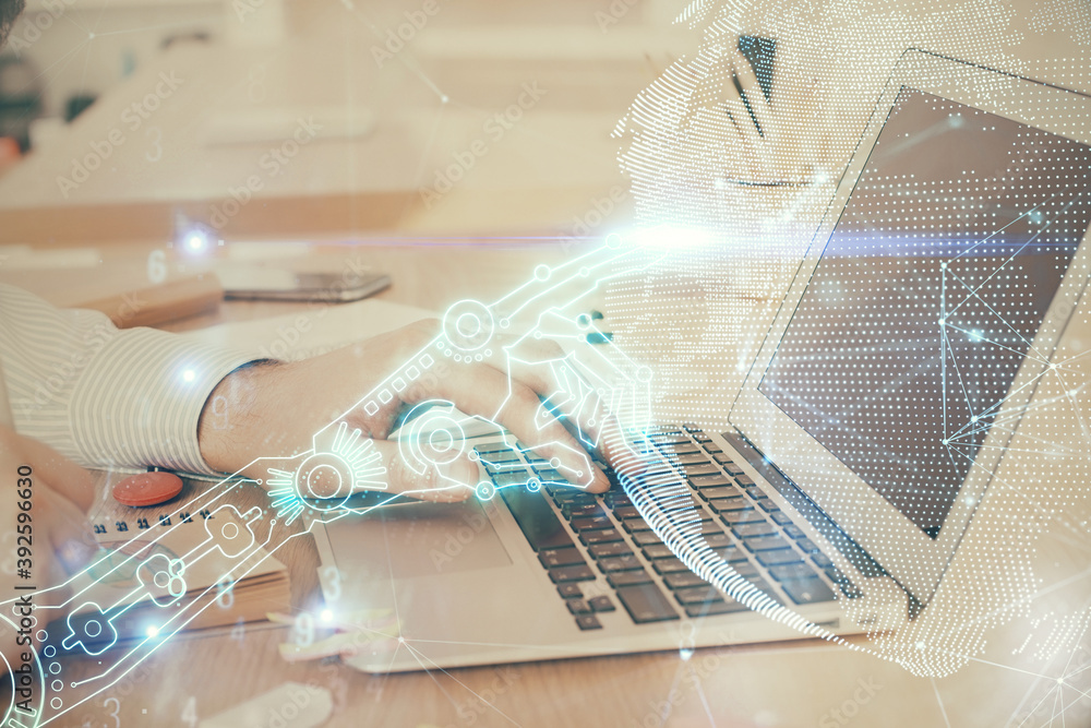 Technology theme hologram with man working on computer on background. High tech concept. Double exposure. Technology theme hologram with man working on computer on background. High tech concept. Double exposure.