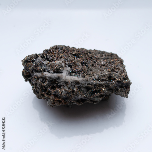 Natural mineral pyrrhotite on a white background photo
