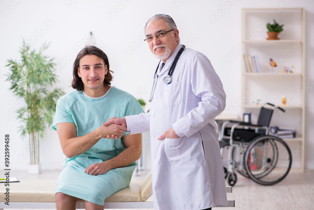 Young male patient visiting experienced doctor Young male patient visiting experienced doctor