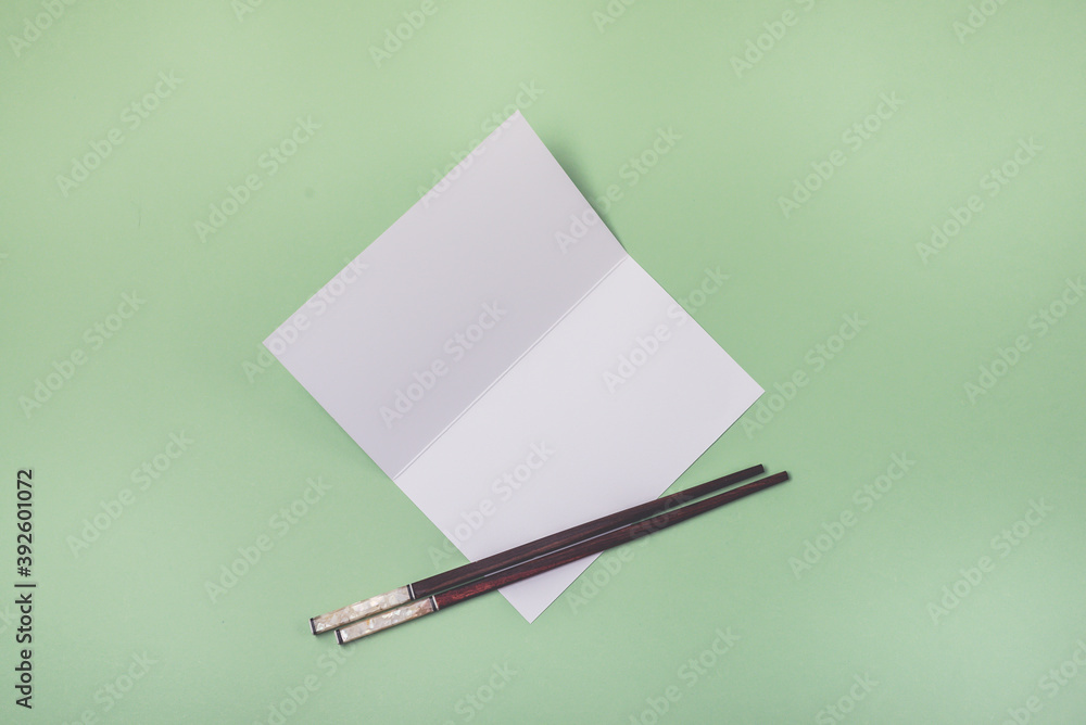 White Paper Brochure with Food Sticks on Light Green Background Mock up with White Paper Blank Horizontal White Paper Brochure with Food Sticks on Light Green Background Mock up with White Paper Blank Horizontal