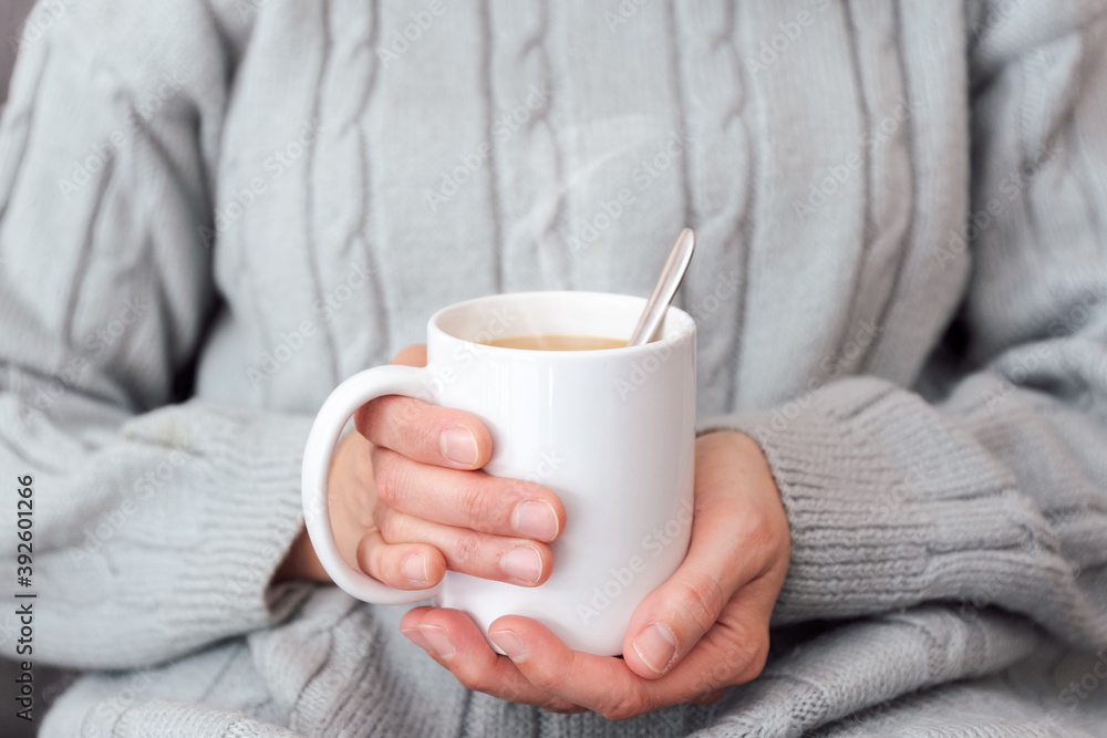 Sipping hot cup of coffee on the couch Sipping hot cup of coffee on the couch