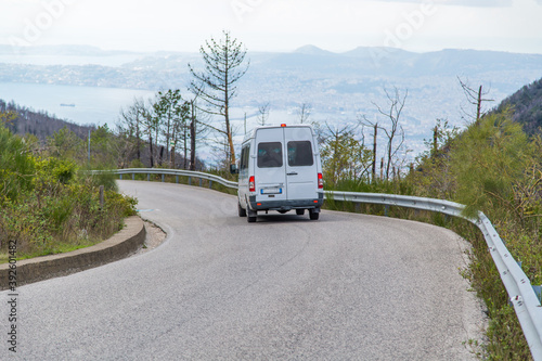 Bus taxi rides down the road on the volcano Vesuvius Naples Italy