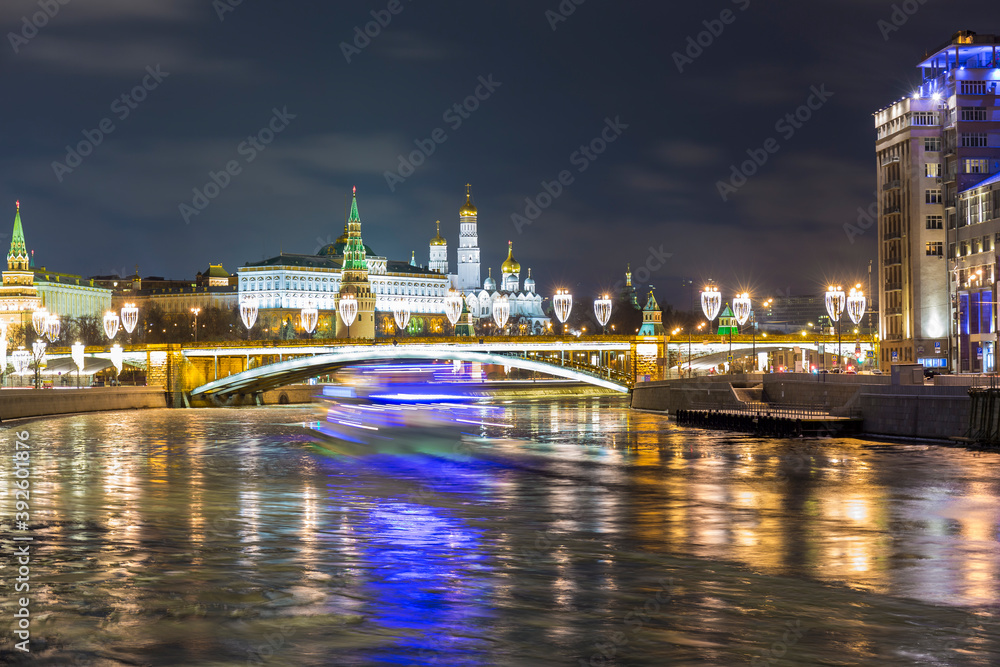 Winter view on Moscow river, citiscape with New Year illumination.