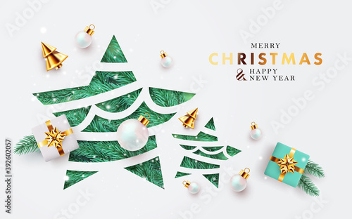 Xmas modern design with paper cut Christmas Star, 3d realistic golden blue and white gifts, pine branches and balls on white background with falling snow. Holiday card, poster, cover, web banner photo