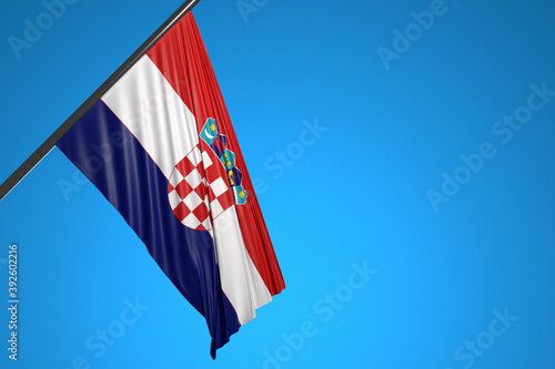 3D illustration of the national flag of Croatia on a metal flagpole fluttering against the blue sky.Country symbol.