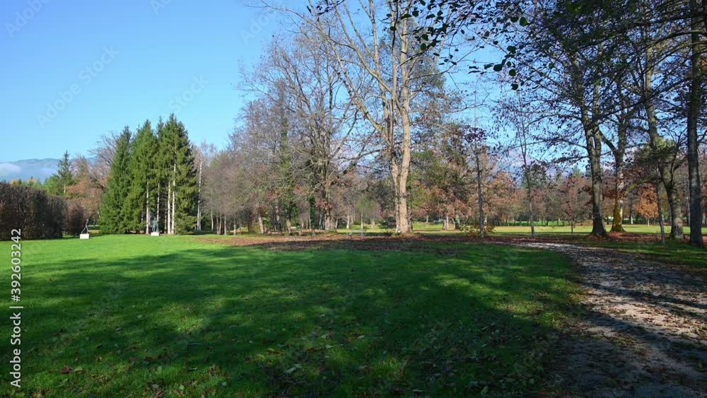 Green meadow and beautiful nature in park Brdo, Slovenia, government venue for diplomatic meetings. Colorful autumn season on bright sunny day. Wide angle, left pan, real time Green meadow and beautiful nature in park Brdo, Slovenia, government venue for diplomatic meetings. Colorful autumn season on bright sunny day. Wide angle, left pan, real time