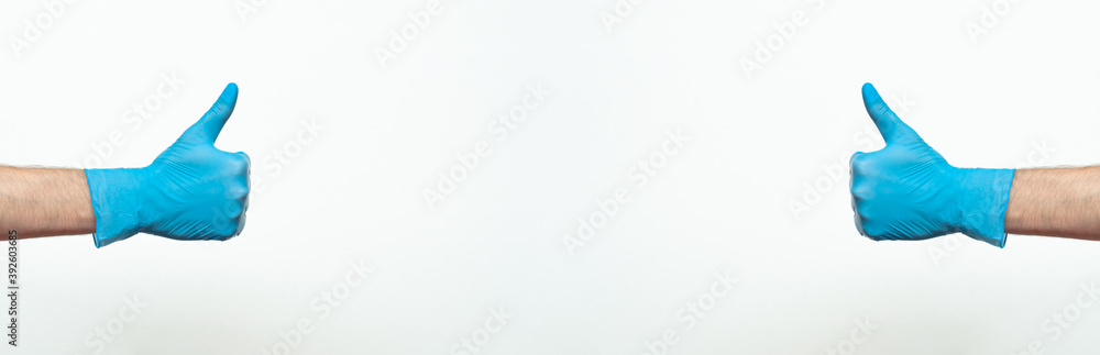 Doctor hand with glove showing like gesture or thumbup as approval, accept or done concept. Copy space. place for text. Banner Doctor hand with glove showing like gesture or thumbup as approval, accept or done concept. Copy space. place for text. Banner
