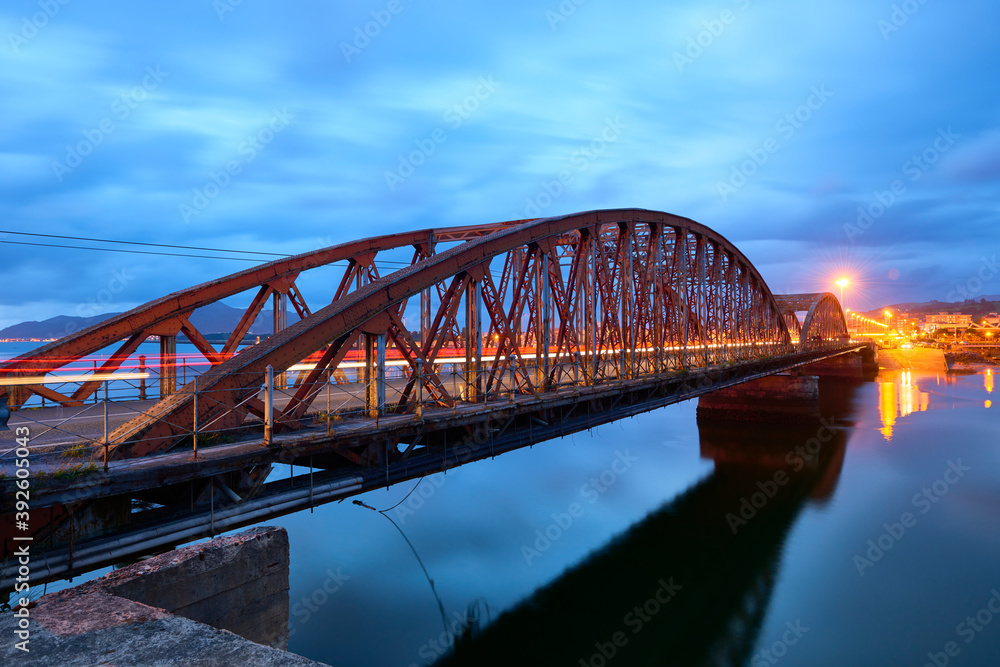 Iron Bridge over the Ason river at evening, Colindres, Cantabria, Spain
