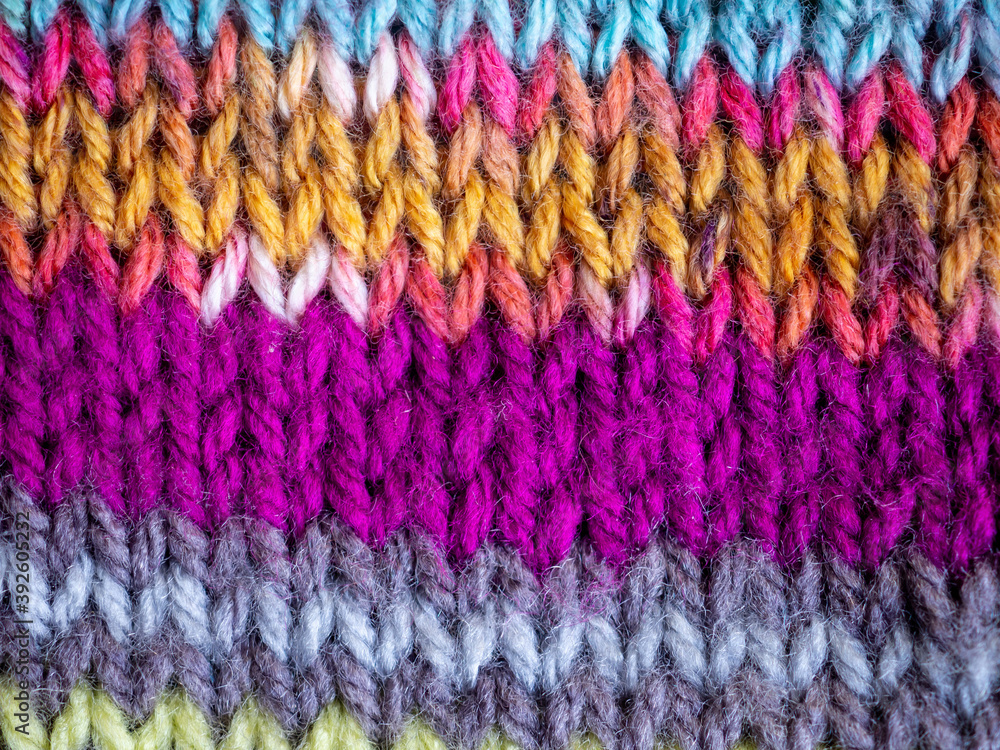 close up of colorful wool hand knitted fabric