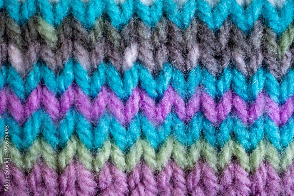close up of colorful wool hand knit texture background 