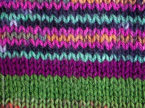 knitting stitches backdrop in purple and green stripes 