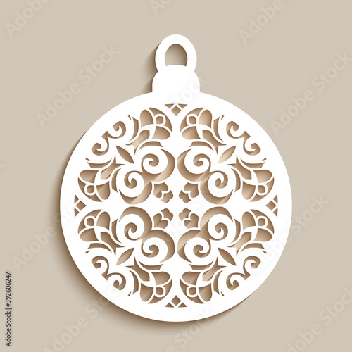 Christmas ornament with curly stencil pattern on neutral background, Xmas bauble with lace texture, cutout paper round decoration, template for cutting