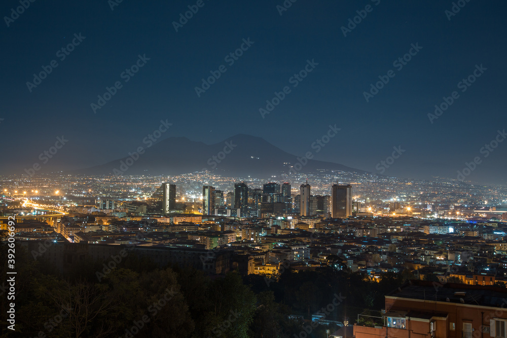 Night View of Naples city and Mount Vesuvius from the panoramic road. Italy