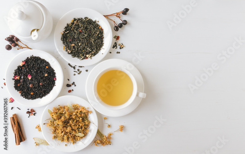 Tea composition on white wooden background with copy space. Tea preparation concept