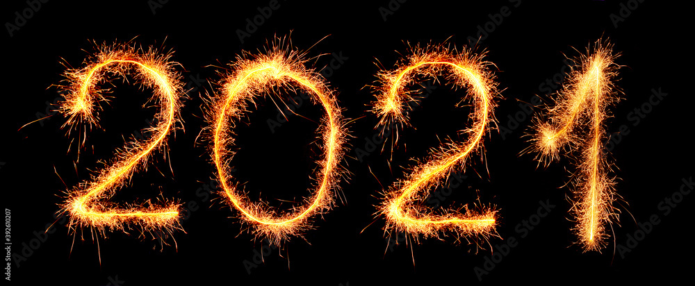 Happy New Year greetings inscription with sparklers figures 2021 on a black background. Happy New Year greetings inscription with sparklers figures 2021 on a black background.