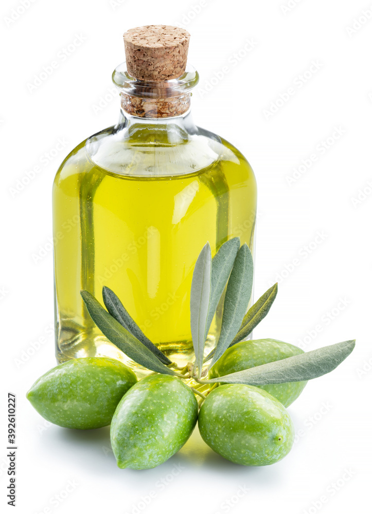 Green natural olives with bottle of olive oil isolated on a white background. Green natural olives with bottle of olive oil isolated on a white background.