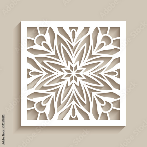 Vintage lace decoration with cutout paper ornament on neutral beige background, square tile with floral stencil pattern, elegant template for laser cutting or wood carving