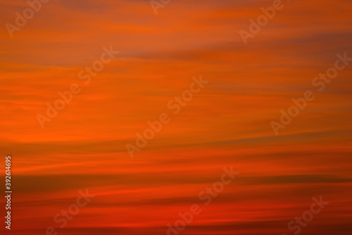 Sky sunset in the evening with colorful orange sunlight. Beautiful majestic nature background