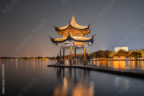 Night view of Jixian pavilion, the landmark at the West Lake in Hangzhou, China.