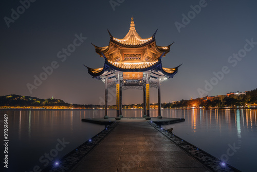 Night view of Jixian pavilion, the landmark at the West Lake in Hangzhou, China. © Zimu