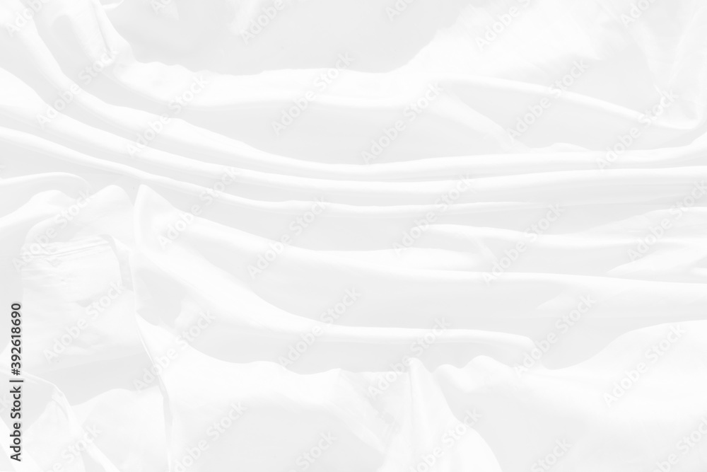 Obraz premium Top view Abstract White cloth background with soft waves.Wave and curve overlapping with different shadow of color,white fabric, crumpled fabric.
