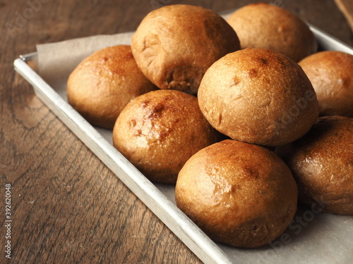 Pile of brown dinner rolls