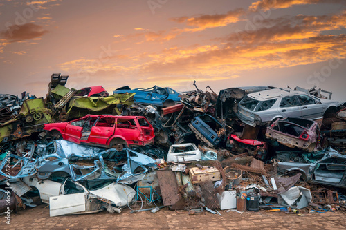 Damaged cars on the junkyard photo