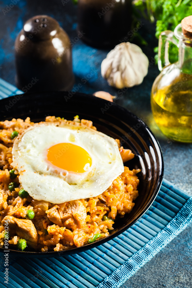 Spicy fried rice with chicken, kimchi and egg Spicy fried rice with chicken, kimchi and egg