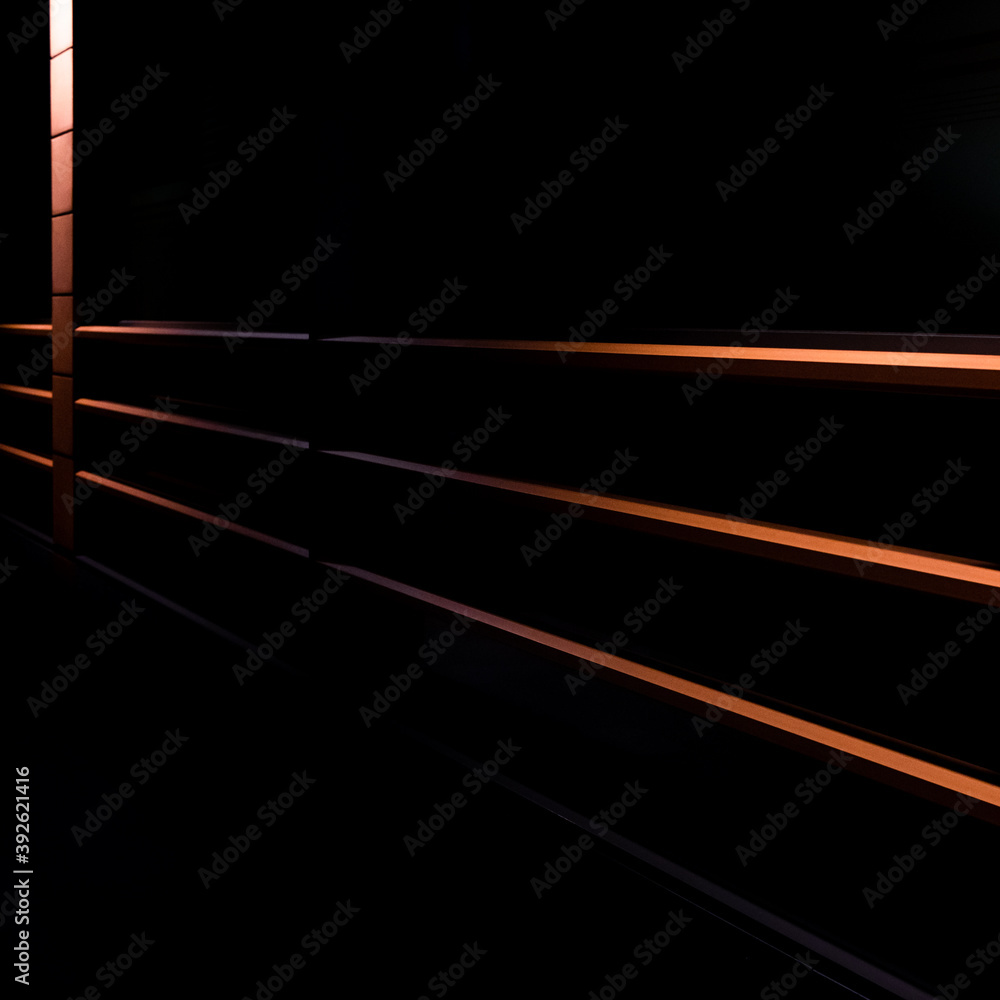 Red on black image of modern building exterior or facade at night. Red on black image of modern building exterior or facade at night.