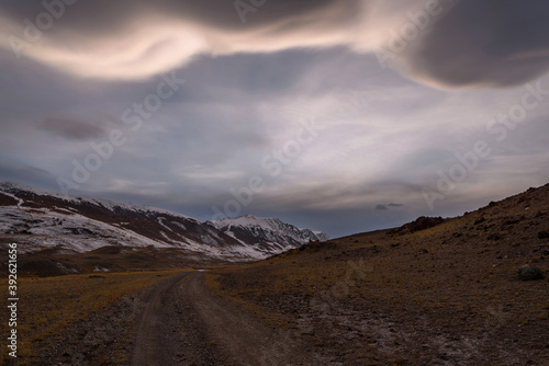 mountains steppe clouds sky road sunset