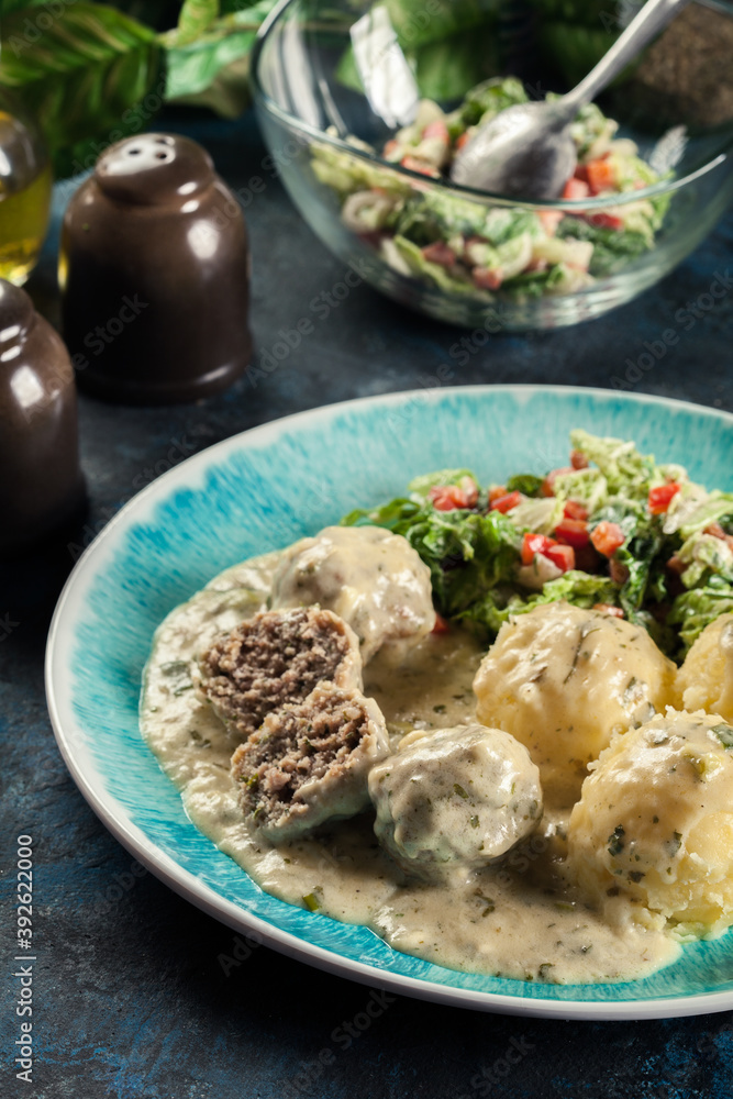 Meatballs with creamy and cheese gravy served with mashed potatoes Meatballs with creamy and cheese gravy served with mashed potatoes