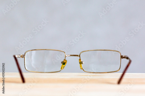 Glasses on a wooden background. Future perspective perspective.