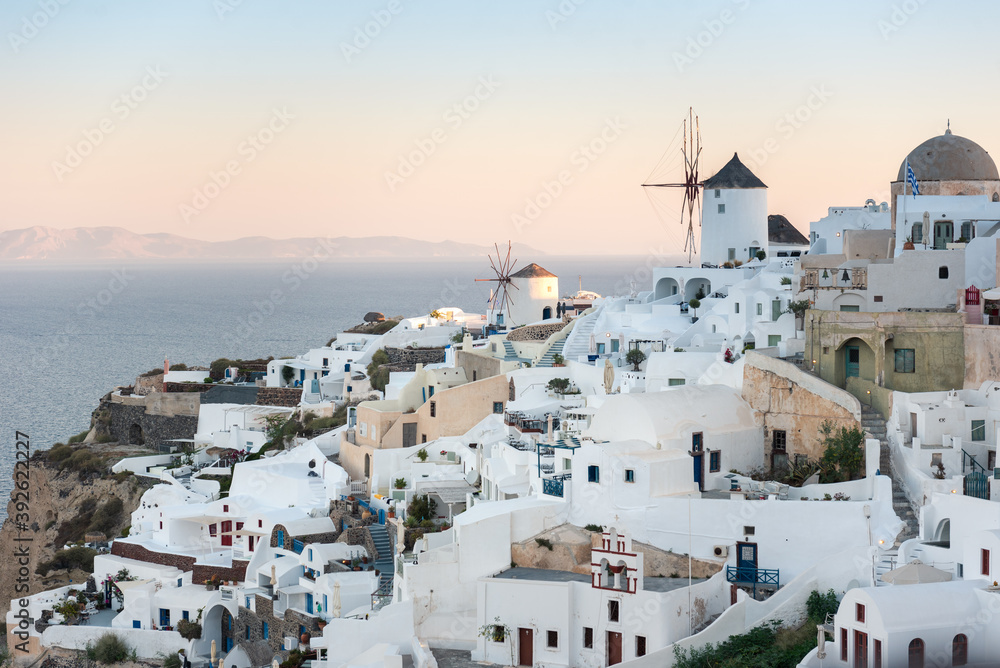 Windmills and white building, traditional Aegean architecture