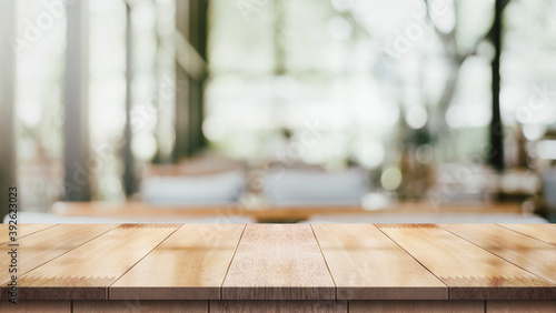 Empty wood table with blur vintage restaurant background.