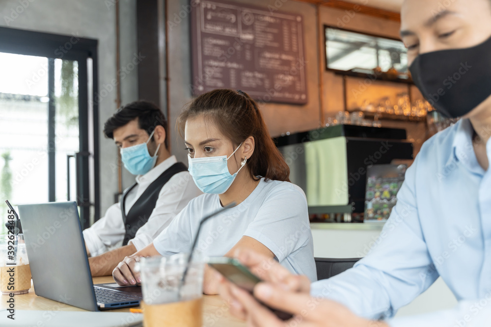 Asian people wearing mask working at coffee shop Asian people wearing mask working at coffee shop