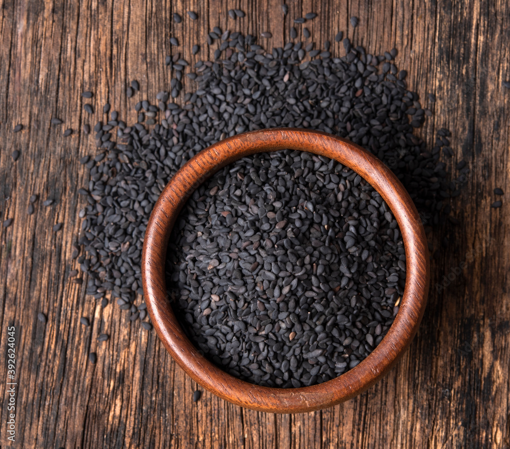 Black sesame seed in the wood bow Black sesame seed in the wood bow