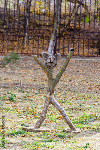 wooden figurine in the autumn park